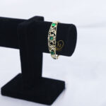 Floral emerald zircon bangle for women Traditional gold finish bangle with green zircon Luxury floral design zircon bracelet