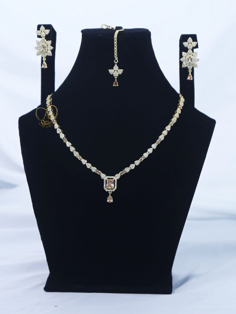 ALIRE JEWELS Golden Champagne Rectangular Stone Necklace Set with gold plating, matching earrings and maang tikka