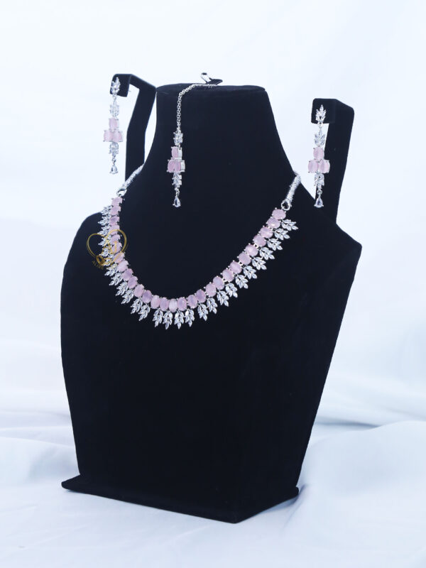 ALIRE JEWELS Pink Stone Necklace Set with silver plated detailing, matching earrings and maang tikka