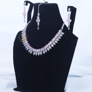 ALIRE JEWELS Pink Stone Necklace Set with silver plated detailing, matching earrings and maang tikka
