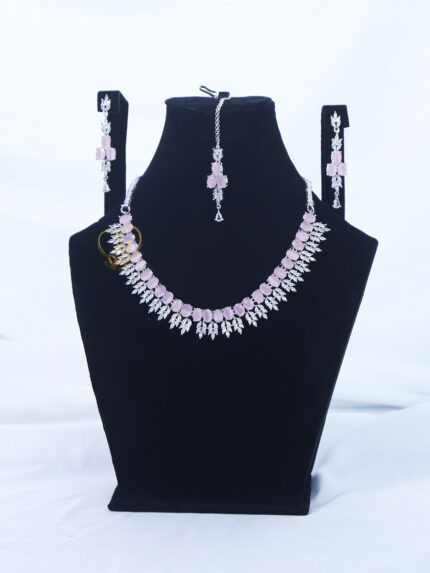 ALIRE JEWELS Pink Stone Necklace Set with silver plated detailing, matching earrings and maang tikka