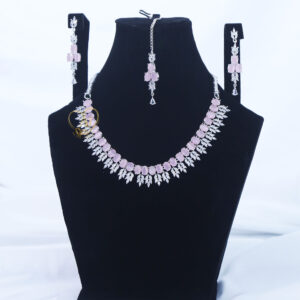 ALIRE JEWELS Pink Stone Necklace Set with silver plated detailing, matching earrings and maang tikka