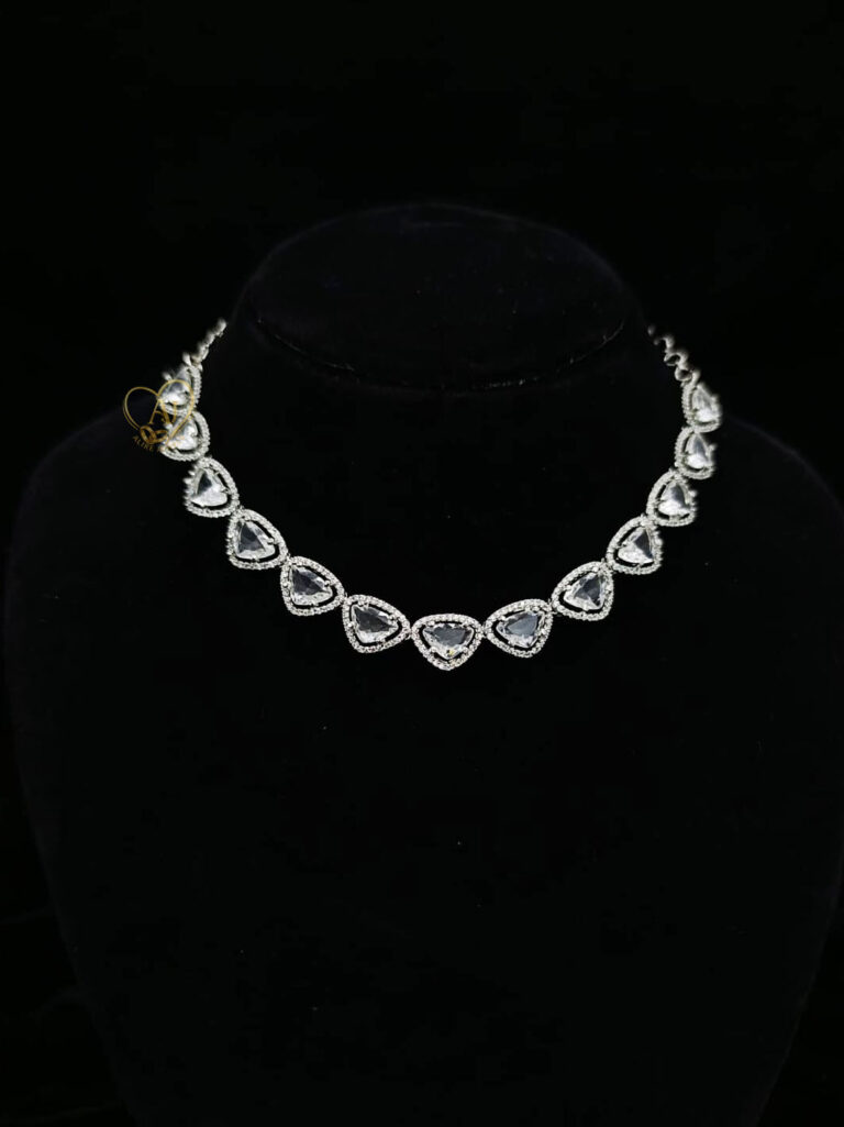 ALIRE JEWELS Heart Shaped White Crystal Necklace Set with silver plating, matching earrings and maang tikka