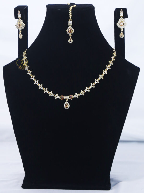 ALIRE JEWELS Golden Champagne Stone Necklace Set with gold plated chain, matching earrings and maang tikka