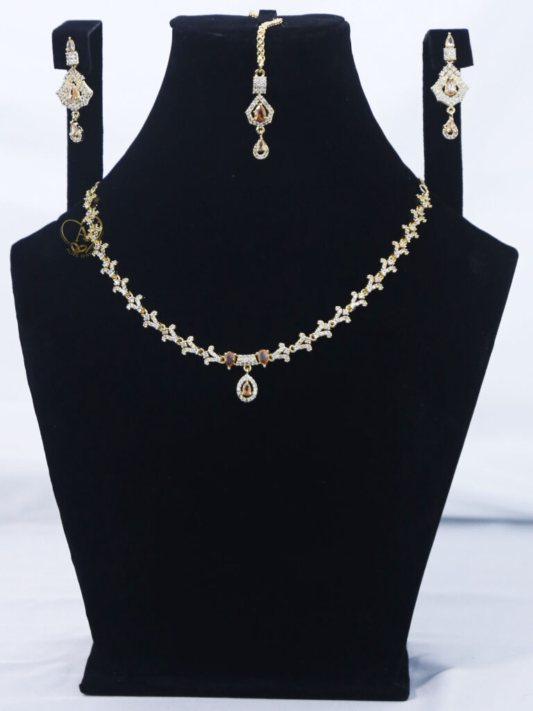 ALIRE JEWELS Golden Champagne Stone Necklace Set with gold plated chain, matching earrings and maang tikka