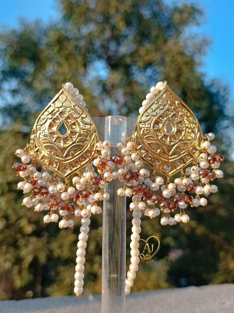 Majestic Teardrop Kundan Earrings – 24K Gold Plated with Pearl Clusters. Luxury kundan earrings with dangling pearl strings and handcrafted detailing
